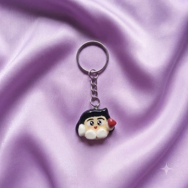 Lumi Pocket Charm_ keychain in lavender, front view